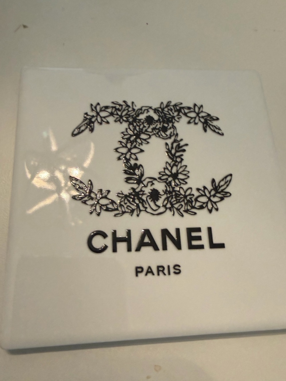 White Ceramic Coasters with Black Floral CC Logo